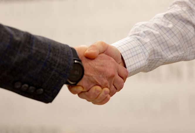Two people shaking hands.